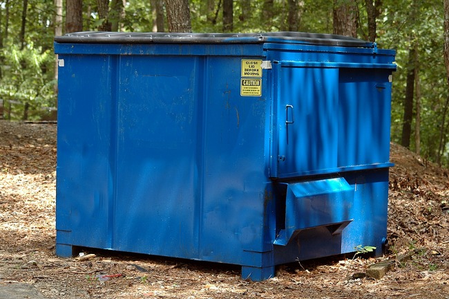 The best option for managing trash removal on the site is to use a dumpster.